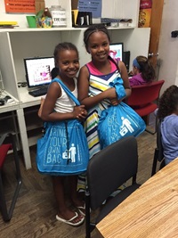 Cambridge kids using their new reusable bags.  Photo courtesy of the Cambridge Community Center.