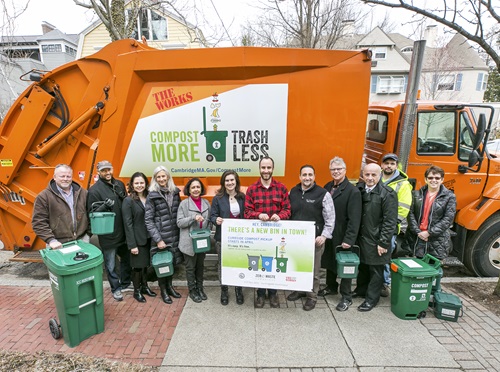 City officials in front of compost truck
