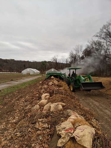 Tractor Turning Yard Waste in a field