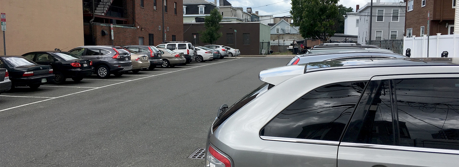 Cars parked in open air lot