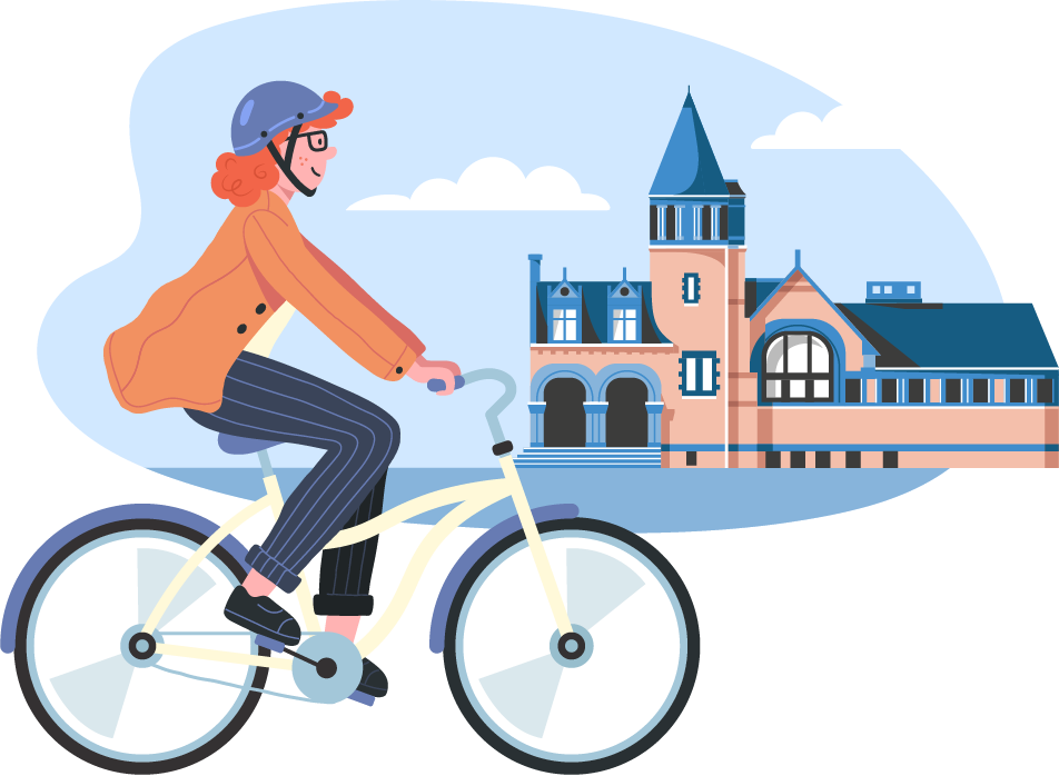 A person riding a bicycle in front of the Cambridge Public Library