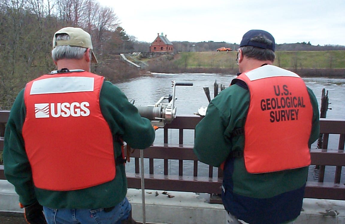 USGS technicians sampling the Stony Brook Reservoir below the dam.