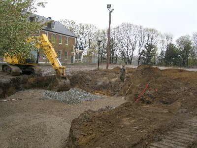 The base is dug behind Neville Manor for the community garden.