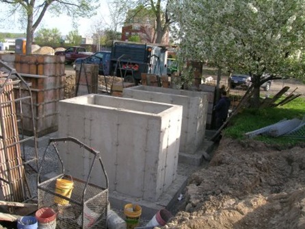 The concrete base for the elevated garden beds during construction.