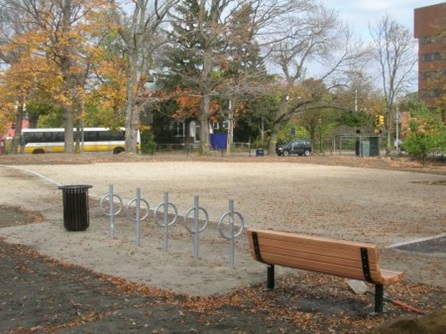 Bike rack and bench placed at the soccer field.