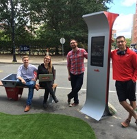 Soofa staff posing with a Soofa Sign at PARKing Day 2016