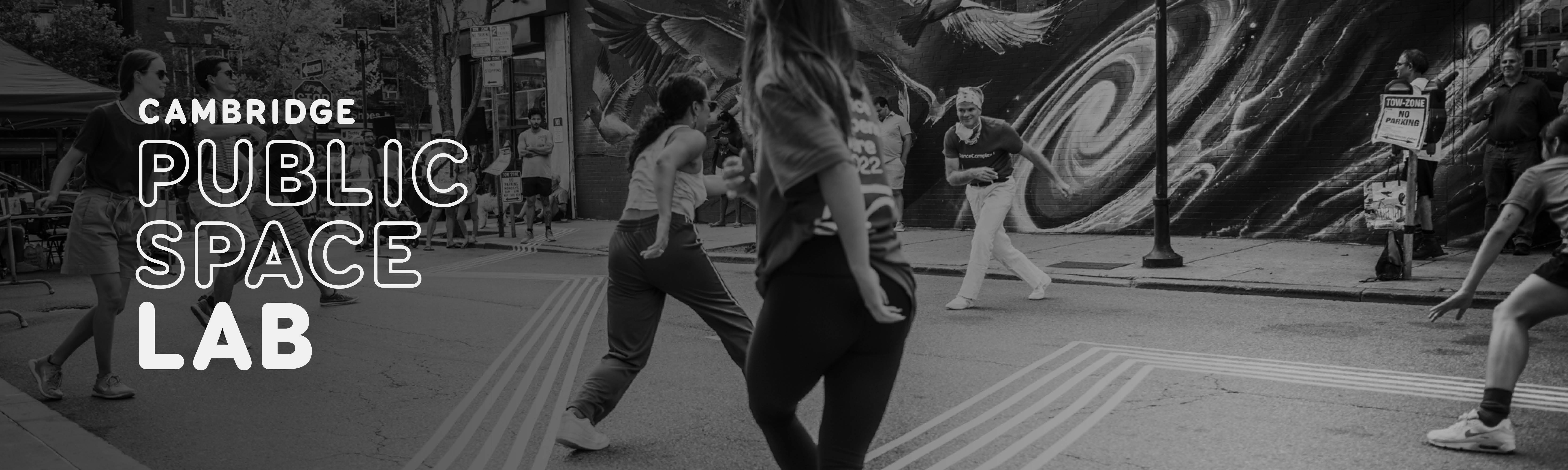 People dancing on a street in Cambridge