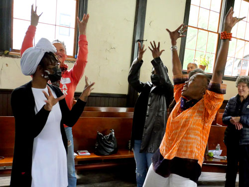 Choreographer Nailah Randall-Bellinger (right) of the RootsUprising dance company participates in the company's Into the Roots Conference in Cambridge, June 2023.
