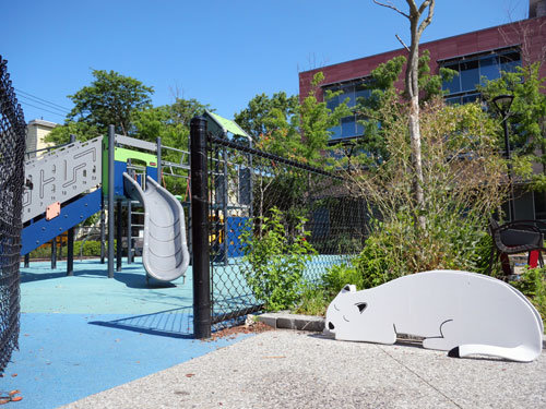 One of Jay Coogan's restored sculptures of cats and dogs at Cambridge’s King Open / Cambridge Street Upper School, Valente Branch Library, and Community Complex.