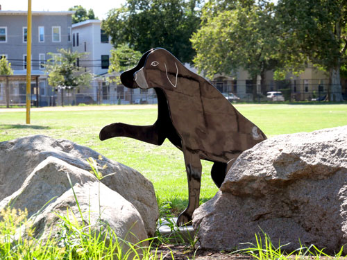 One of Jay Coogan's restored sculptures of cats and dogs at Cambridge’s King Open / Cambridge Street Upper School, Valente Branch Library, and Community Complex.