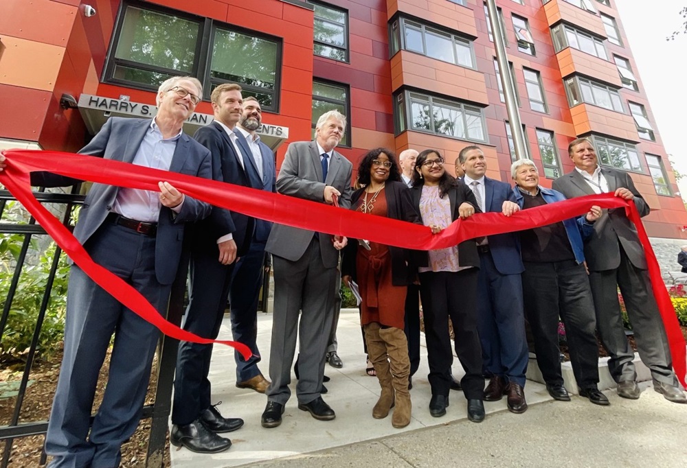 Cambridge Housing Authority and City staff at a ribbon-cutting ceremony for the opening of a new property.