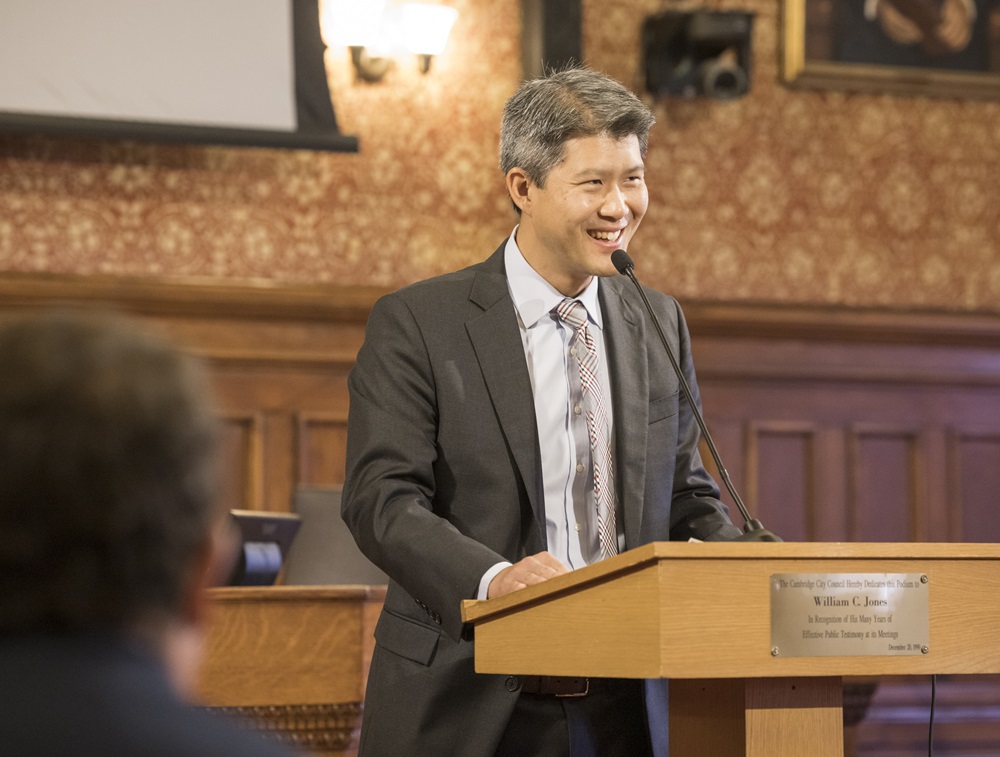 City Manager Yi-An Huang swearing in at a podium in City Hall.