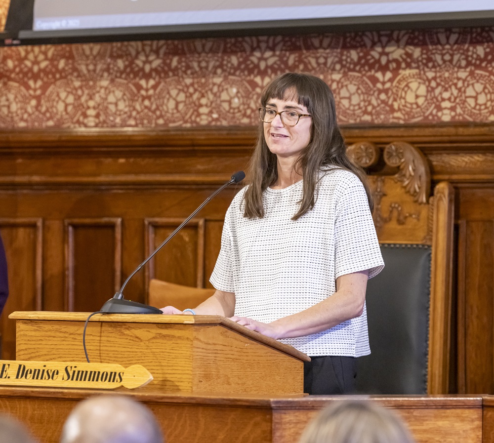 Liz Mengers Speaks at Podium in City Hall