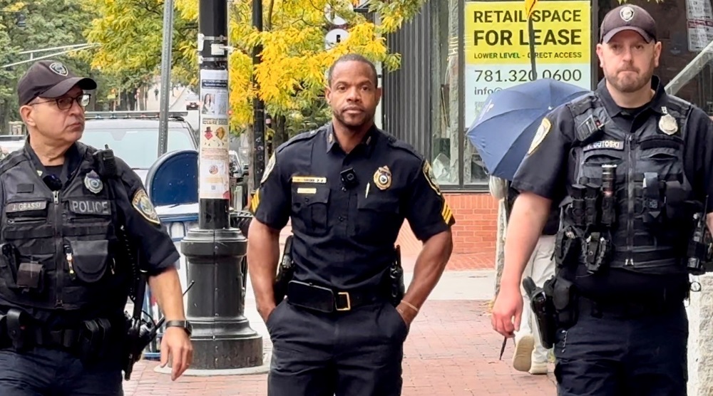 : Sergeant Lowe (center) and Officer Grassi (left) and Gutoski (right) patrol Harvard Square.