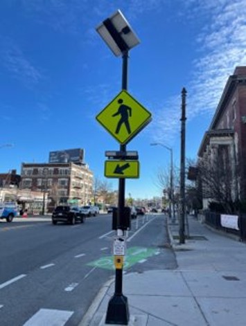 From left to right: A Rectangular Rapid Flashing Beacon (RRFB), an interactive speed limit sign, a raised crosswalk.