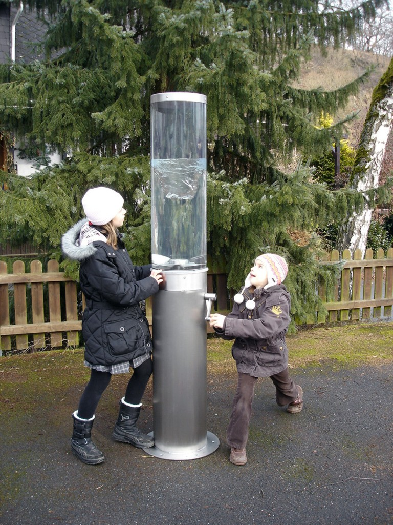 Two children playing with the Water Whirl