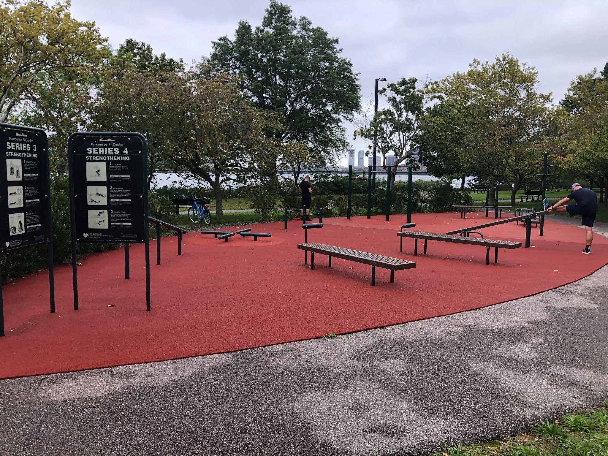 Outdoor gym with benches and exercise instructions